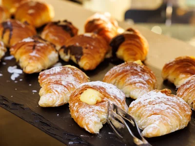 The picture shows a detail of the stuffed brioche on the breakfast buffet.