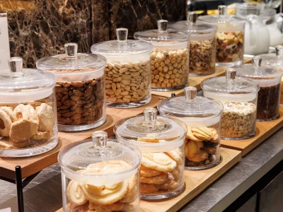 The picture shows part of the breakfast buffet set up with biscuits and dried fruit.