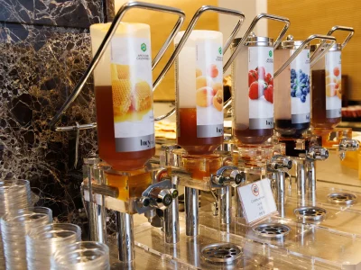 The picture shows the honey and jam dispensers for filling the brioche.